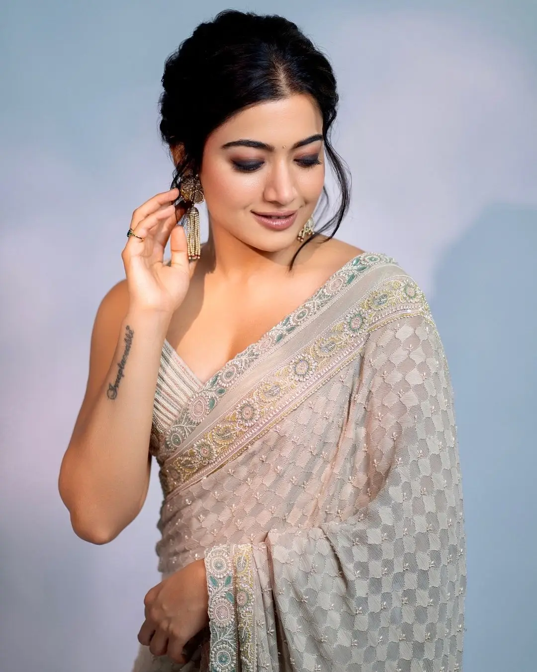 rashmika mandanna wearing beautiful earrings green saree sleeveless blouse